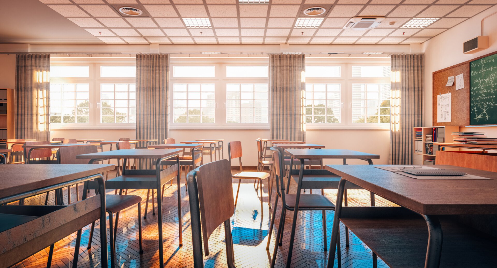 interior of a traditional school classroom with wooden floor and furniture