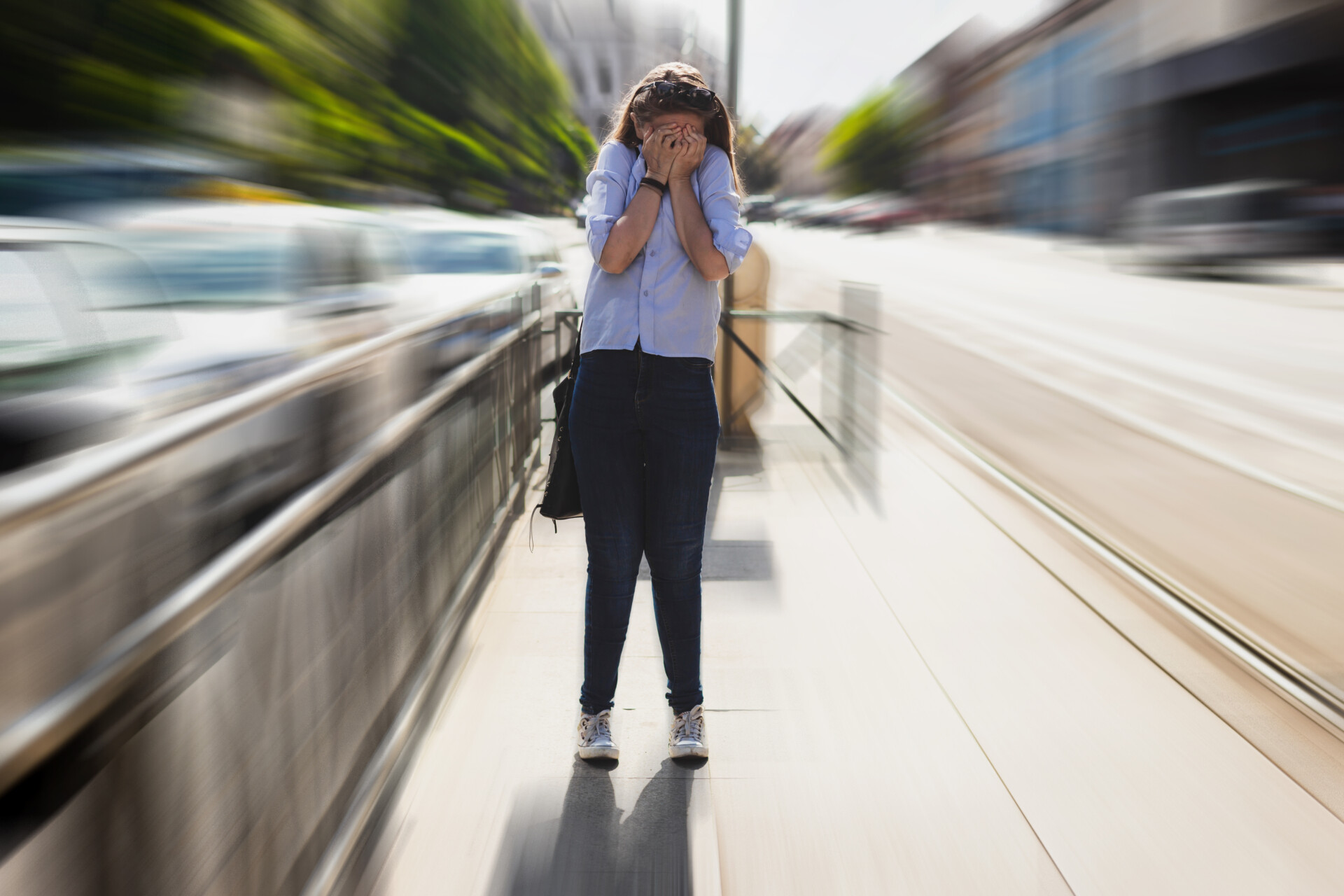 a woman in the street experiencing a panic attack